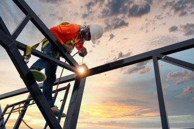 welder-is-welding-steel-steel-roof-truss-working-height-equipment-fall-arrestor-device-worker-with-hooks-safety-body-harness-worker-construction-site
